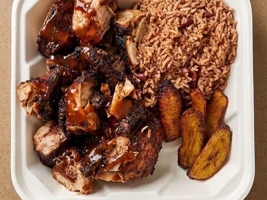 Jerk chicken with rice and peas and fried plantain