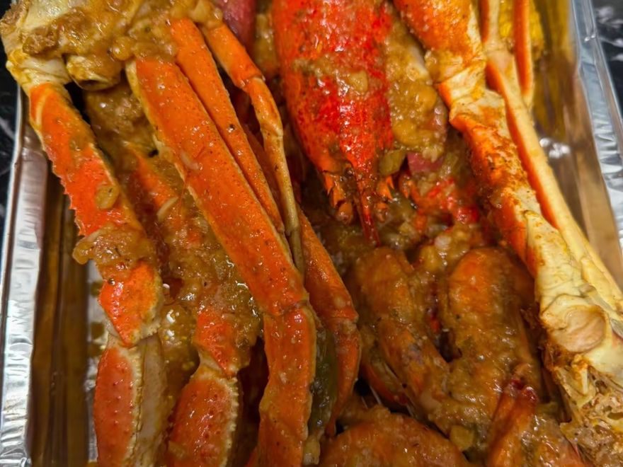 Snow crab clusters and lobster in CCK boil sauce