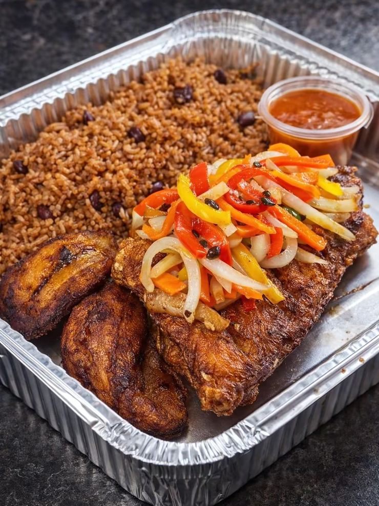 Fried snapper with peppers and onions, rice and peas and plantain